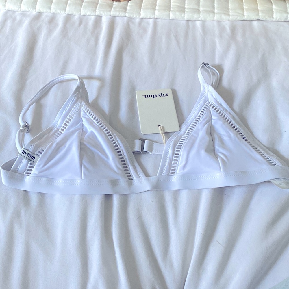 A white Bikini top with adjustable straps .